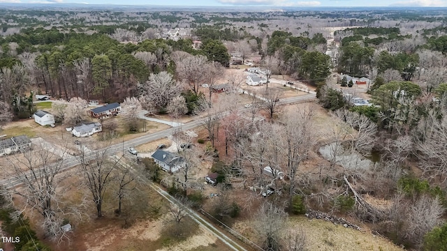 drone / aerial view featuring a view of trees