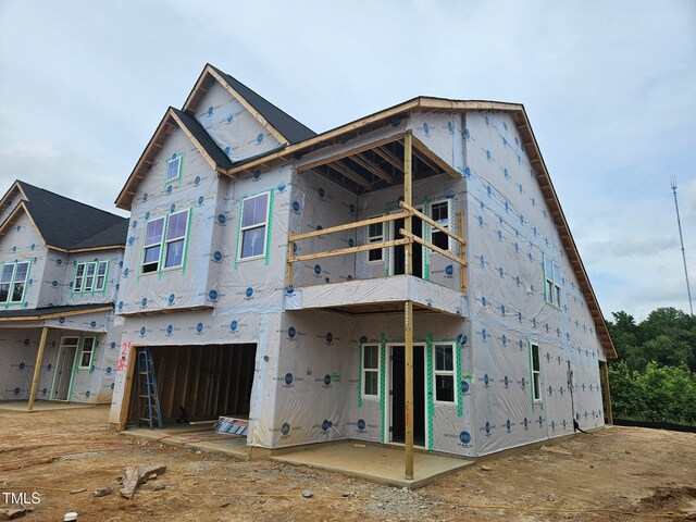 247 Meadowbark Bnd Unit 29, Garner, NC 27529 - back of property with an attached garage and a balcony