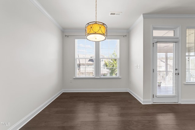 unfurnished dining area with dark wood-style floors, visible vents, baseboards, and ornamental molding