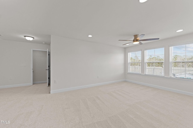 unfurnished room featuring recessed lighting, light colored carpet, baseboards, and ceiling fan