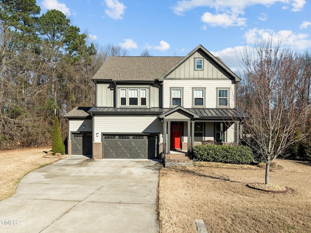 view of front of house with a standing seam roof, an attached garage, covered porch, concrete driveway, and board and batten siding