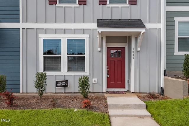 entrance to property featuring board and batten siding