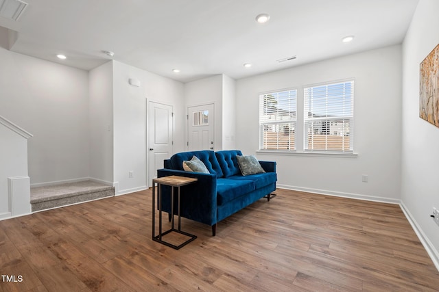 sitting room with visible vents, wood finished floors, and recessed lighting