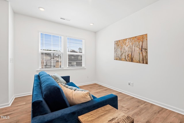 sitting room featuring recessed lighting, visible vents, baseboards, and wood finished floors