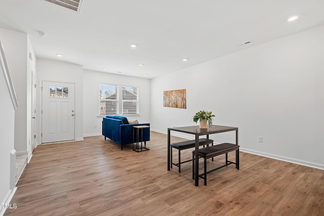 dining space featuring light wood-style floors, recessed lighting, and visible vents