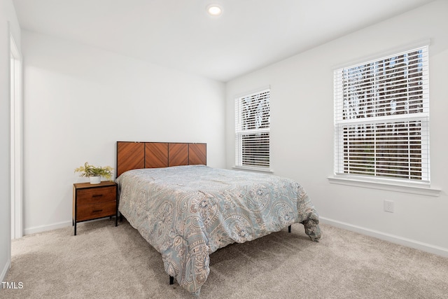 bedroom with carpet, baseboards, and recessed lighting