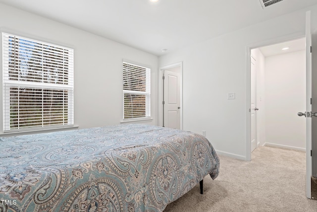 bedroom with visible vents, baseboards, carpet flooring, and recessed lighting