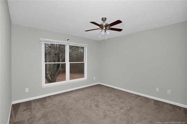 empty room featuring a ceiling fan, carpet, and baseboards