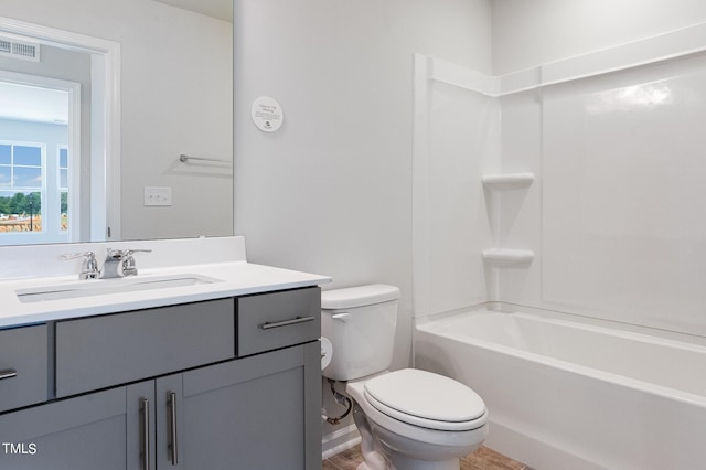 full bath with washtub / shower combination, visible vents, vanity, and toilet