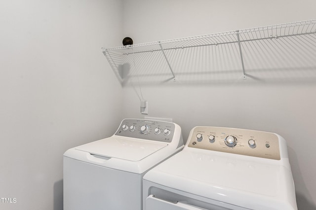 clothes washing area with laundry area and washing machine and dryer