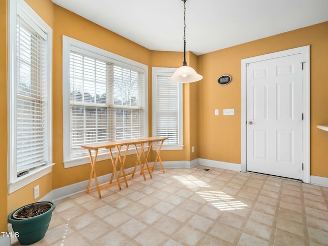 dining room with baseboards