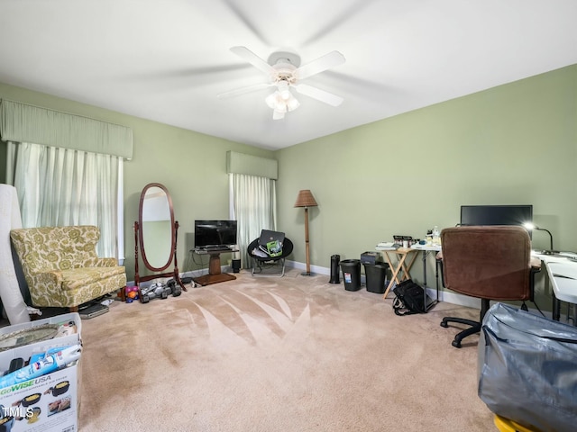 home office featuring plenty of natural light, carpet, baseboards, and a ceiling fan