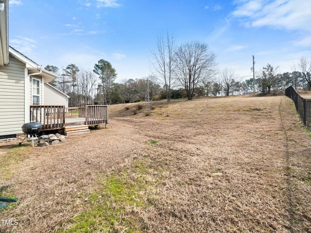 view of yard featuring a wooden deck