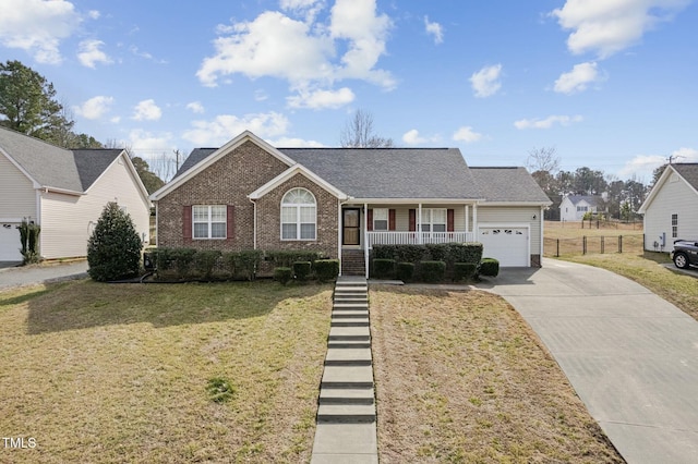 single story home featuring a garage, concrete driveway, a porch, a front lawn, and brick siding