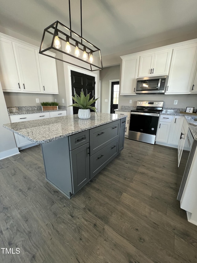 kitchen with stainless steel appliances, gray cabinets, and white cabinets