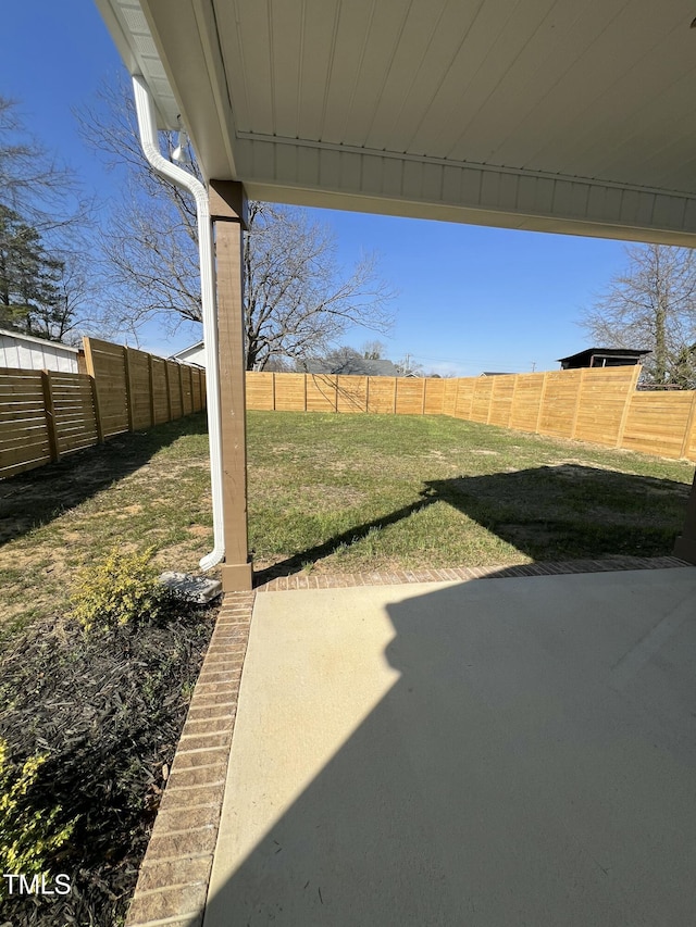 view of yard with a fenced backyard