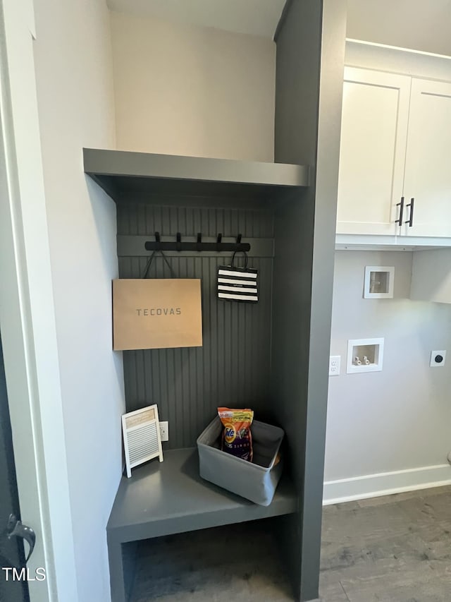 mudroom with wood finished floors and baseboards