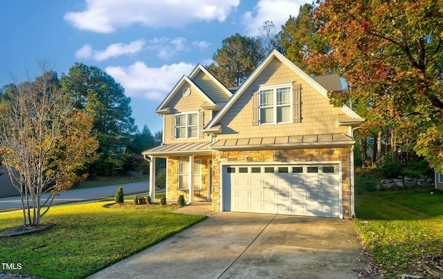 view of front of house featuring metal roof, driveway, stone siding, a front lawn, and a standing seam roof