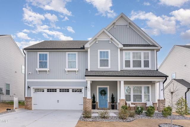 craftsman house featuring driveway, a garage, a shingled roof, covered porch, and board and batten siding