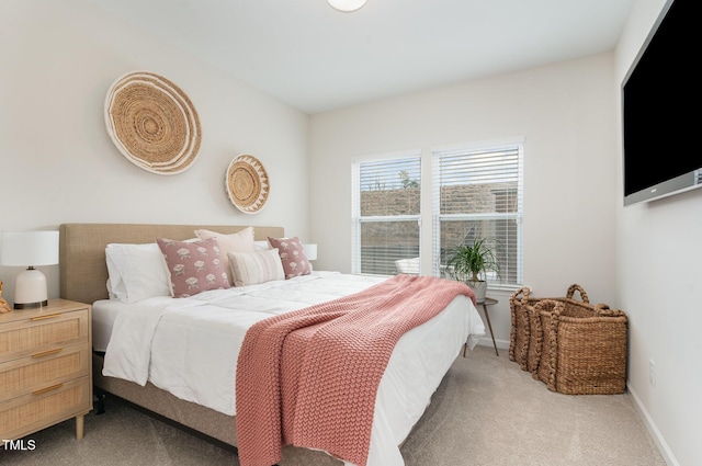 bedroom with carpet and baseboards