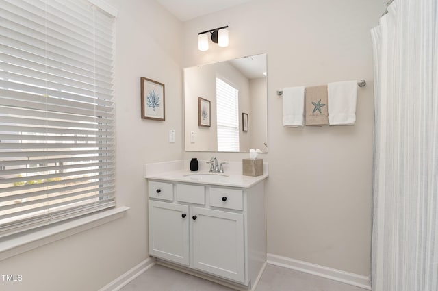 bathroom featuring baseboards and vanity