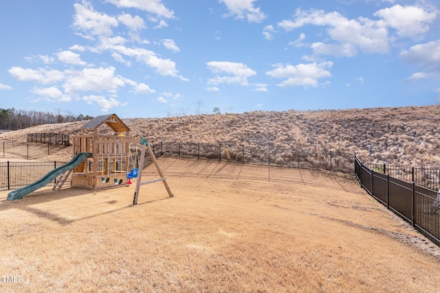 view of play area featuring a rural view and fence