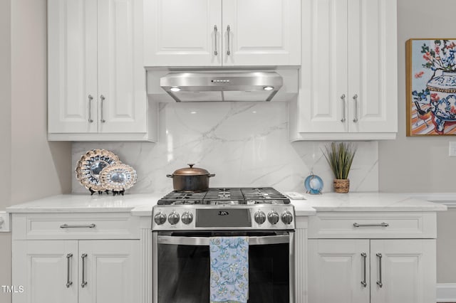 kitchen featuring ventilation hood, backsplash, stainless steel gas stove, and white cabinets