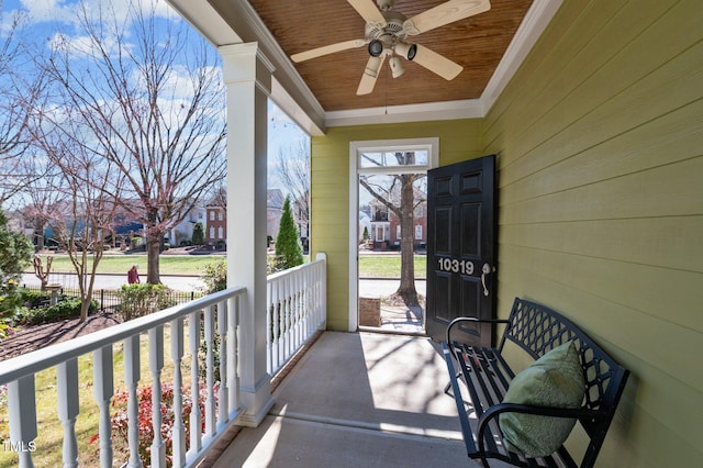 balcony with a porch and ceiling fan