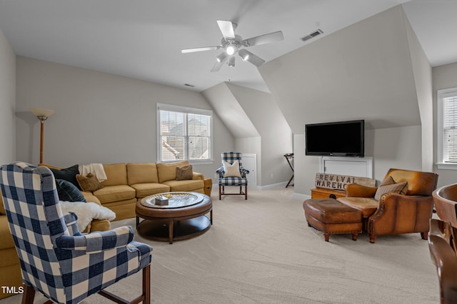 living room featuring visible vents, baseboards, ceiling fan, vaulted ceiling, and carpet floors