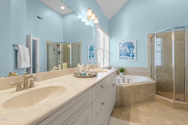 full bathroom with a sink, a bath, a stall shower, and tile patterned flooring