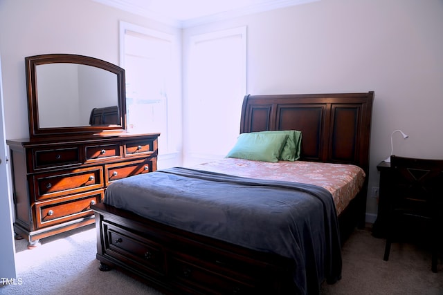 bedroom with carpet and crown molding