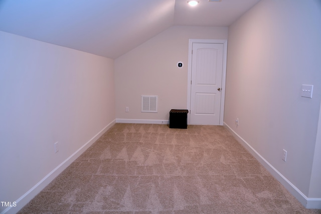 bonus room with carpet floors, visible vents, vaulted ceiling, and baseboards