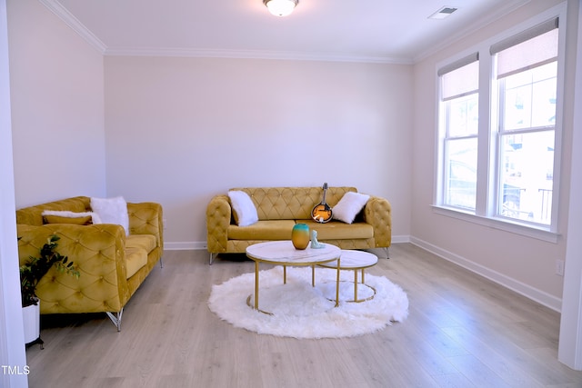 living area featuring ornamental molding, visible vents, baseboards, and wood finished floors