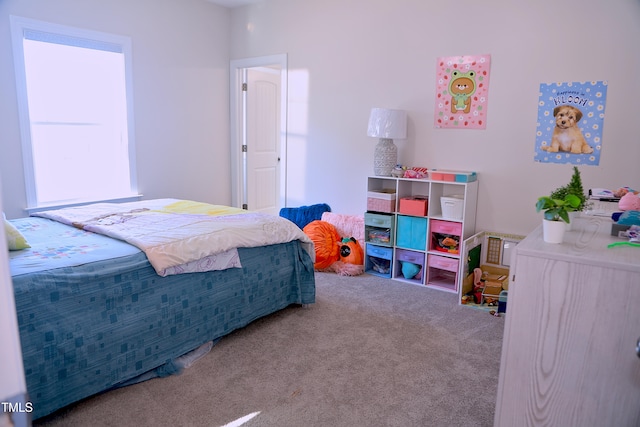 bedroom featuring carpet