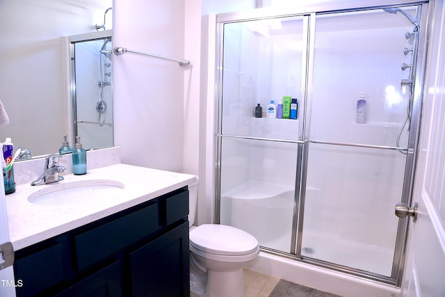 full bathroom with toilet, a stall shower, tile patterned flooring, and vanity