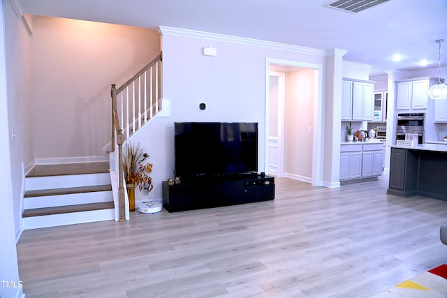 living area with light wood-type flooring, stairs, visible vents, and ornamental molding