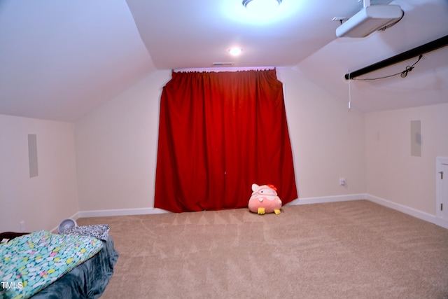 bedroom featuring baseboards, vaulted ceiling, and carpet flooring