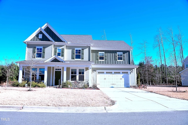 view of front of property featuring a garage, driveway, roof with shingles, a porch, and board and batten siding