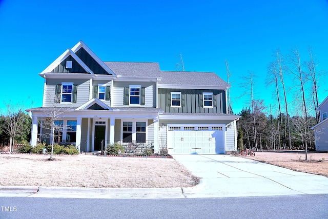 view of front of house featuring roof with shingles, a porch, concrete driveway, board and batten siding, and a garage