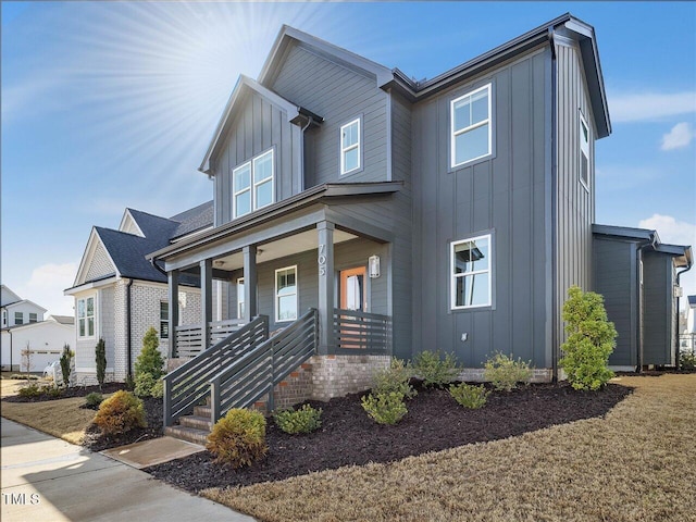 view of front facade featuring a porch and board and batten siding