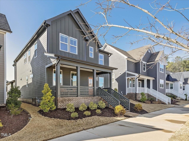 view of front of property featuring board and batten siding and covered porch