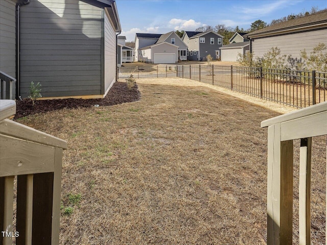 view of yard with a residential view and fence