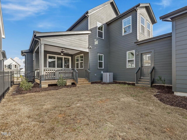 back of property featuring entry steps, fence, cooling unit, and a wooden deck