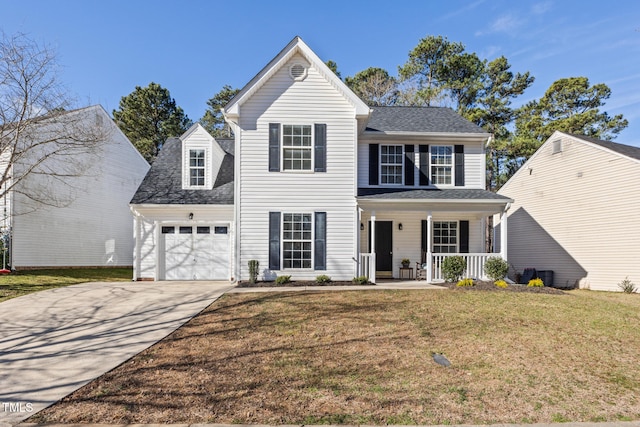 traditional home with covered porch, a garage, a shingled roof, driveway, and a front yard