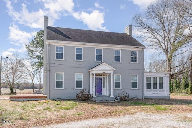 colonial inspired home featuring crawl space and a chimney