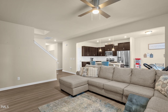 living area with ceiling fan, recessed lighting, visible vents, baseboards, and dark wood-style floors