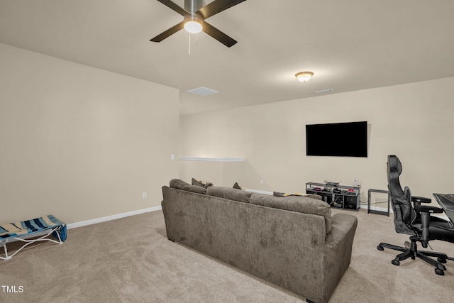 carpeted living room featuring a ceiling fan, visible vents, and baseboards