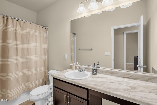 bathroom featuring toilet and vanity