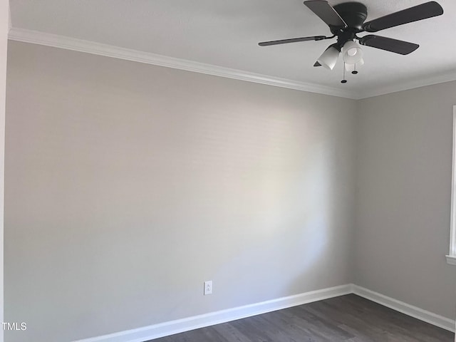 empty room featuring dark wood-type flooring, ornamental molding, baseboards, and ceiling fan