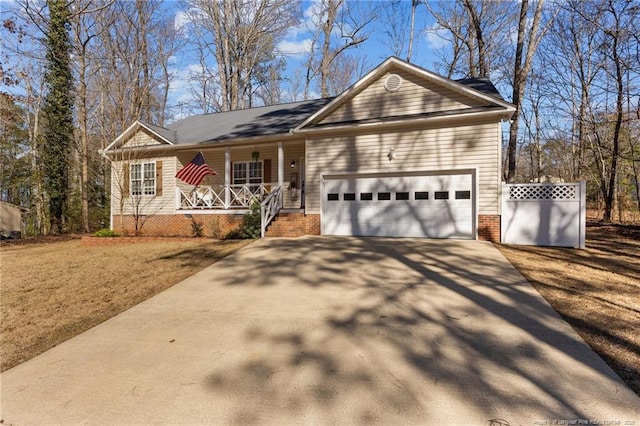 ranch-style home featuring a garage, covered porch, and concrete driveway